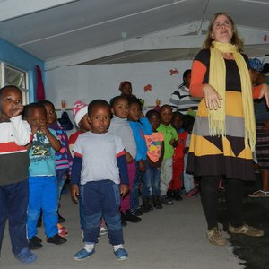 Flower Valley ECD Programme Co-ordinator, Gabrielle Jonker with children at the Good Hope ECD Centre in Masakhane